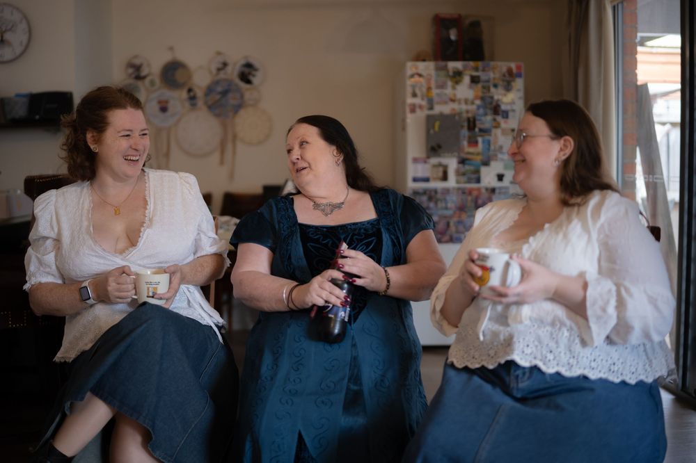Four candid shots show friends enjoying coffee and conversation while sitting together on a couch.