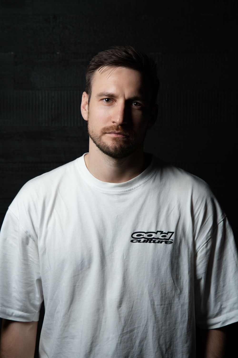 Portrait series shows a person in white t-shirt against dark background with dramatic side lighting.