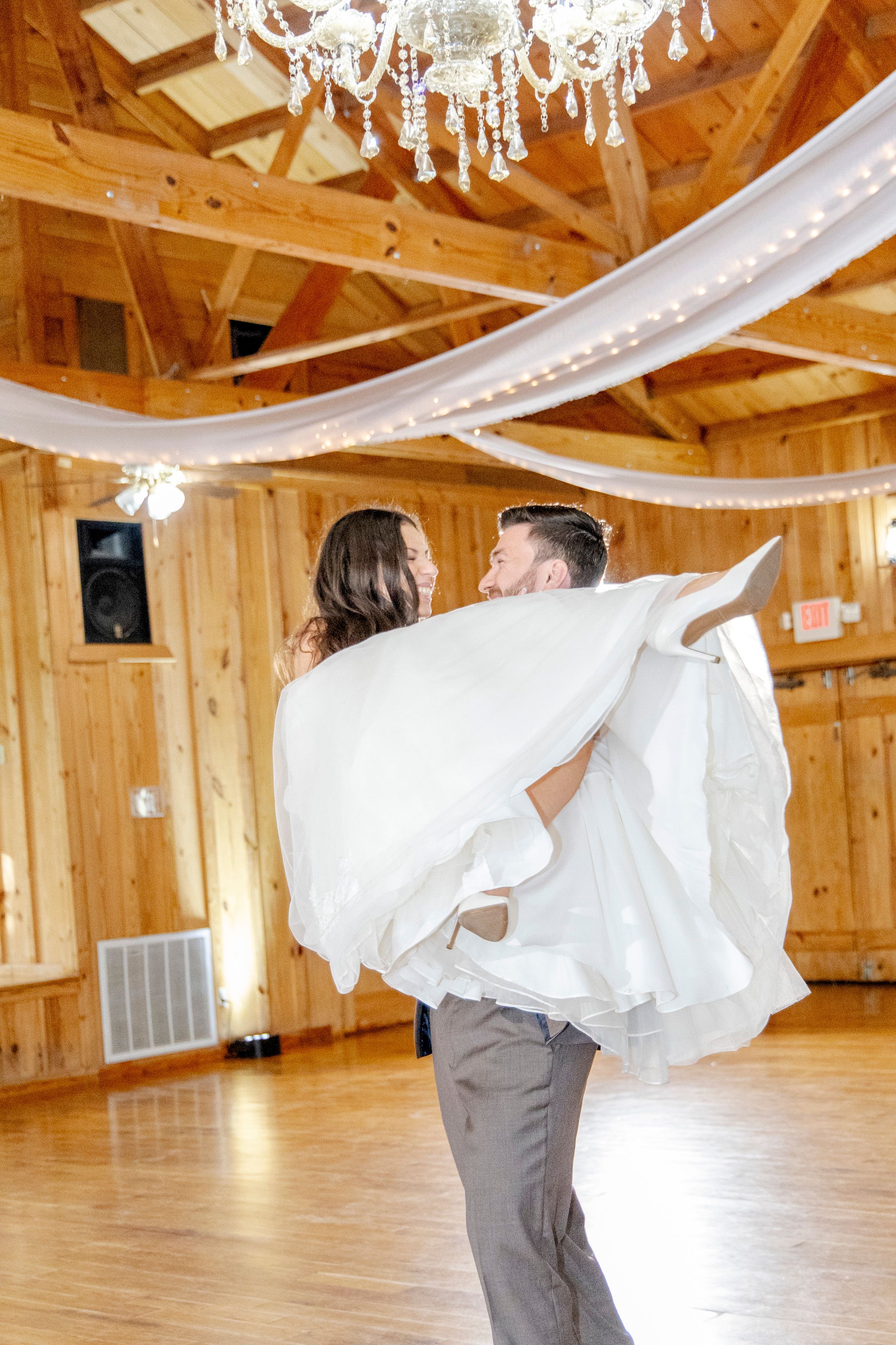 Dripping Springs rustic barn wedding reception with candid guest moments
