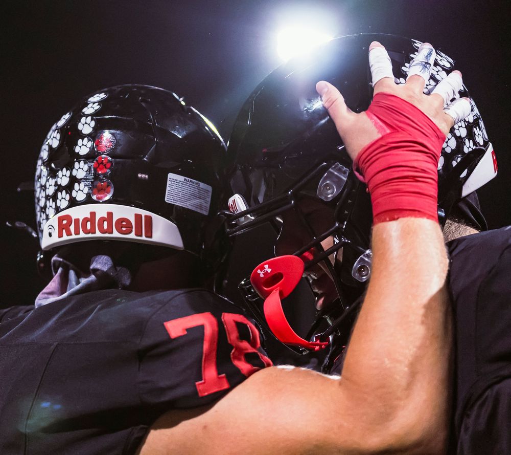 Football players celebrating together