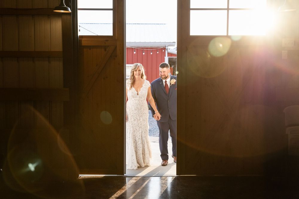 Sunlight streams through windows in a rustic wooden interior creating dramatic lighting and shadows.
