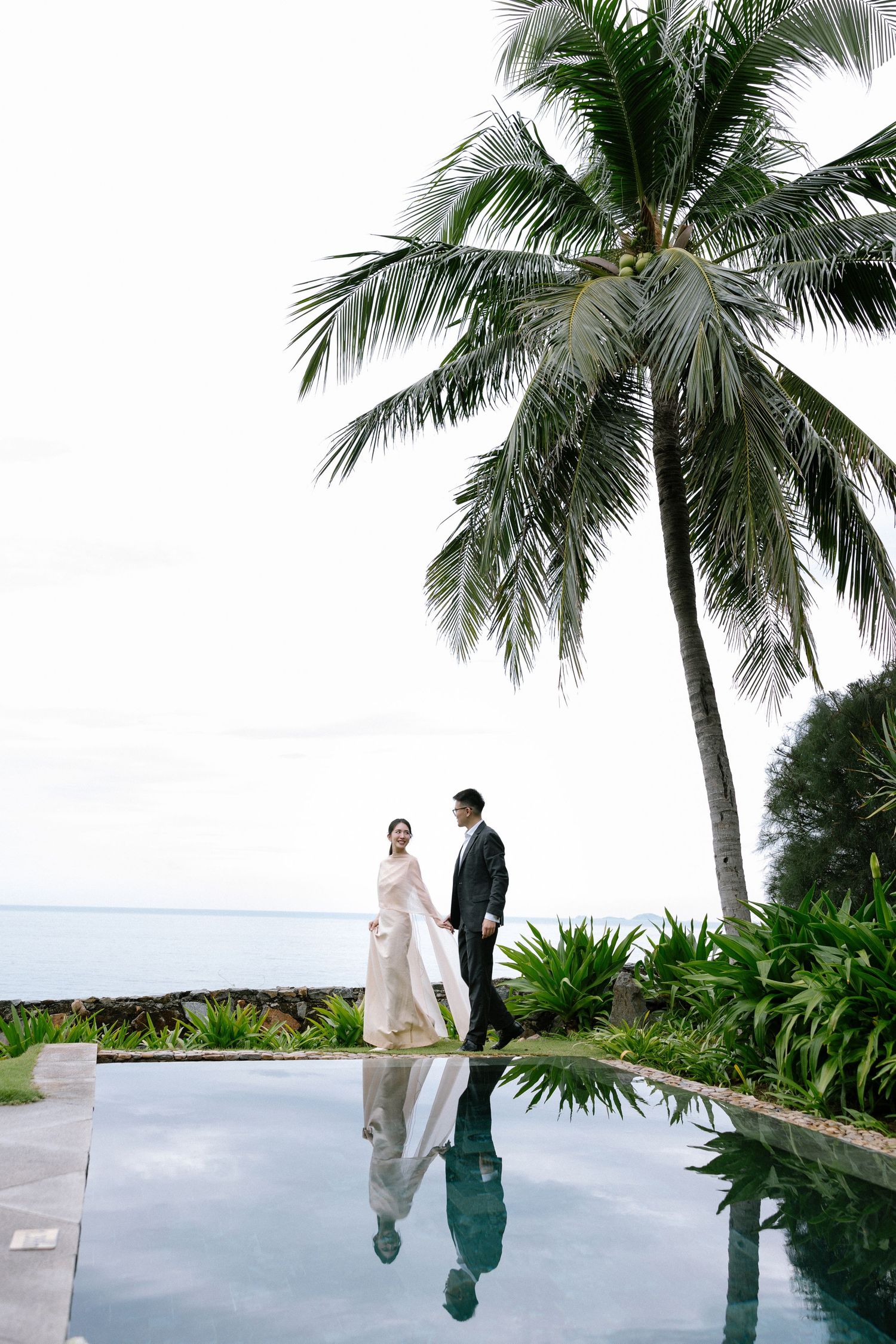 Nha Trang beach prewedding photoshoot with couple in elegant dress and suit
