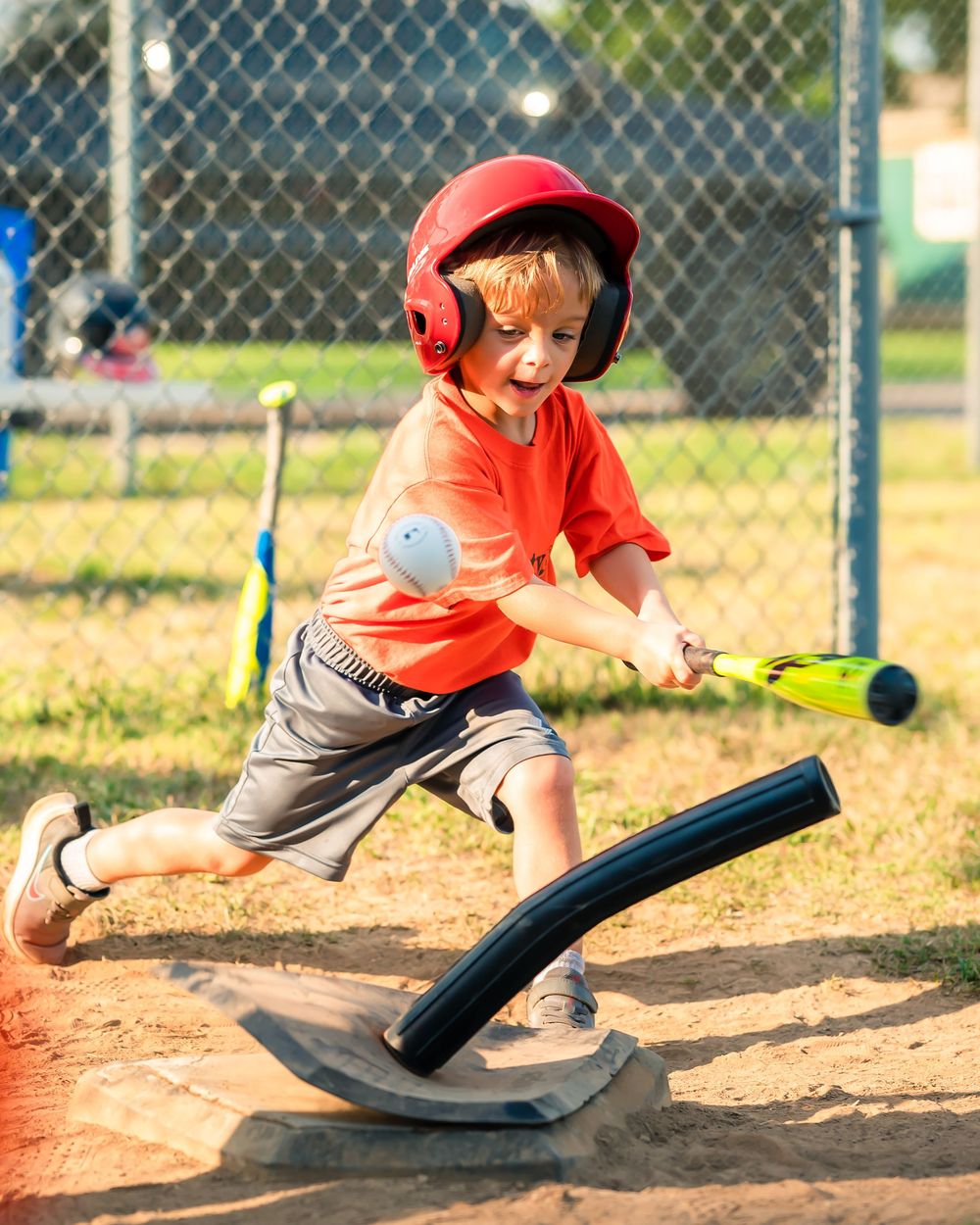 Series of action shots showing a young baseball player sliding into base during a game.