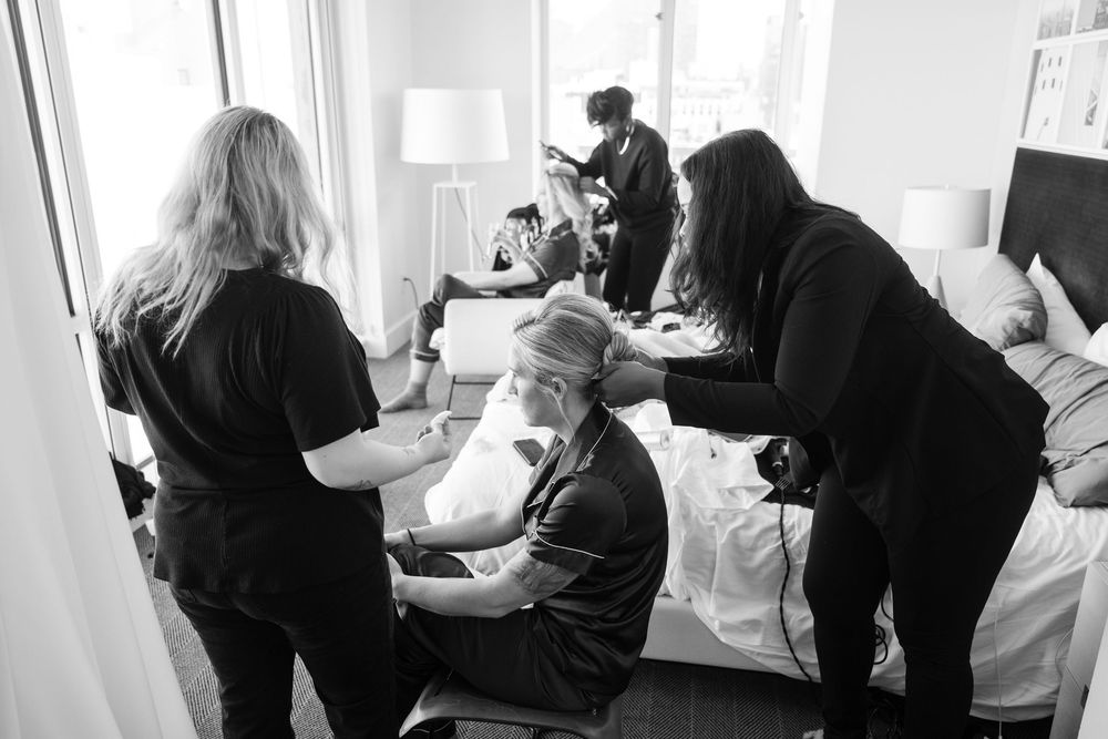 Black and white candid shots of people mingling at an indoor event.