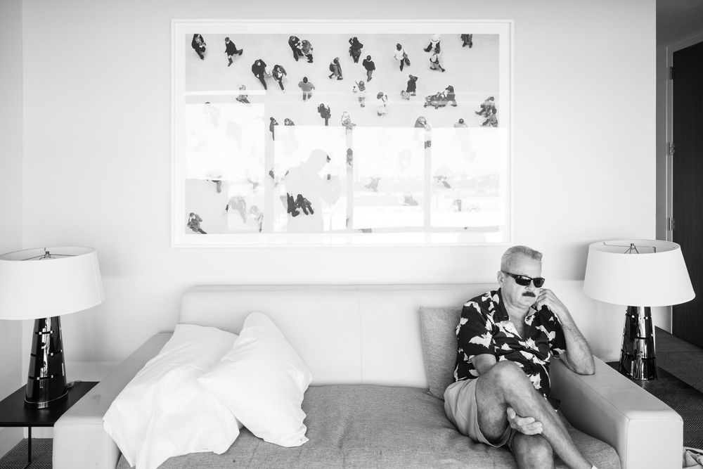 Minimalist black and white art gallery wall with framed photographs.