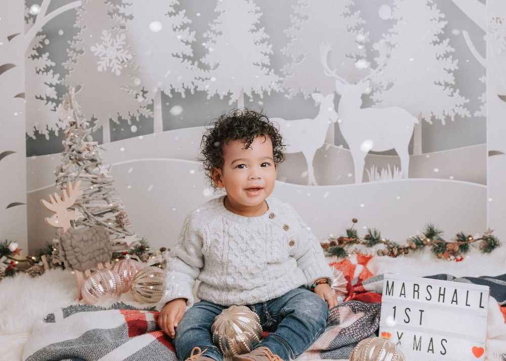 A festive holiday photo collage featuring winter decor, presents, and cozy sweaters in a white and gray color scheme.
