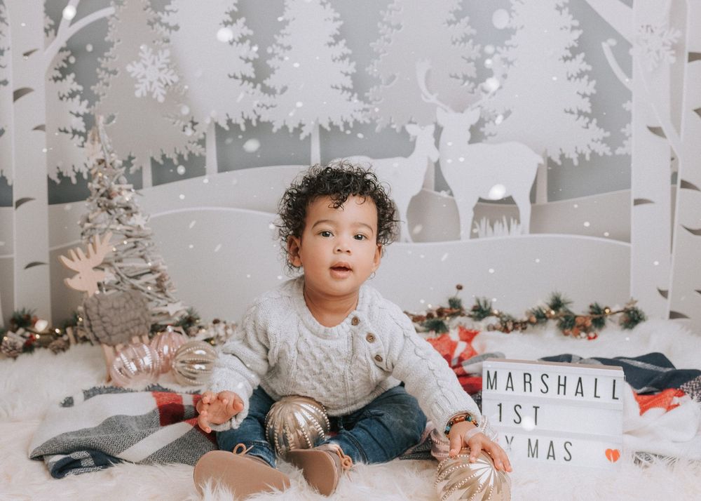 A winter wonderland themed photo series with white decor, trees, and holiday gifts against a light backdrop.