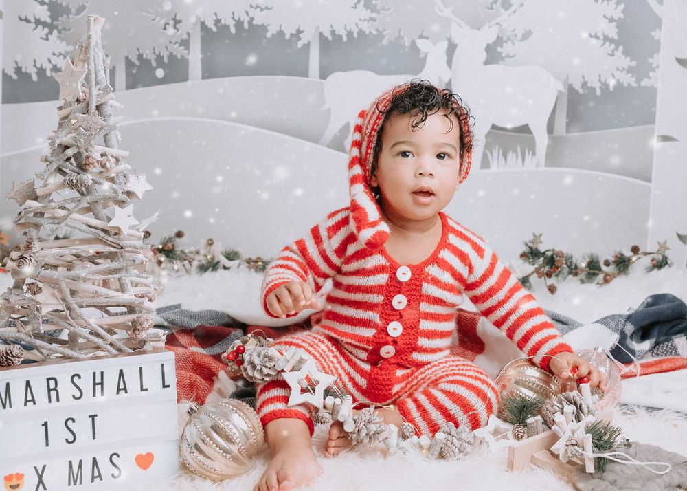 A festive holiday photo series showing someone in red and white stripes against a snowy white Christmas backdrop.