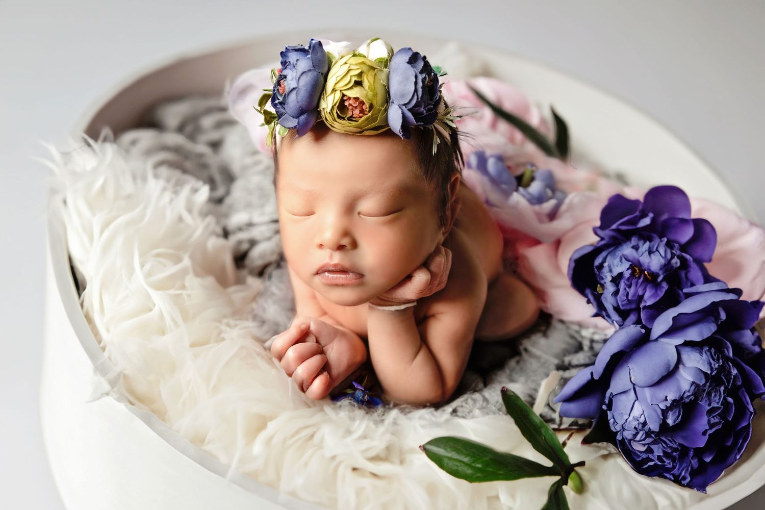 Adorable composite of baby in safety of newborn fresno photographer colibri captures