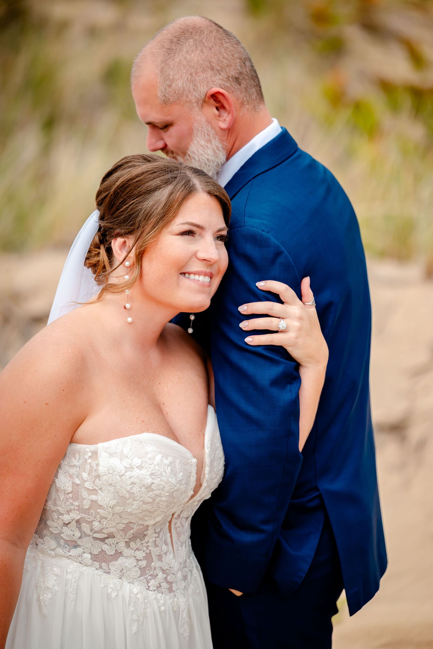 Close-up series of tender wedding couple moments in a romantic outdoor setting.