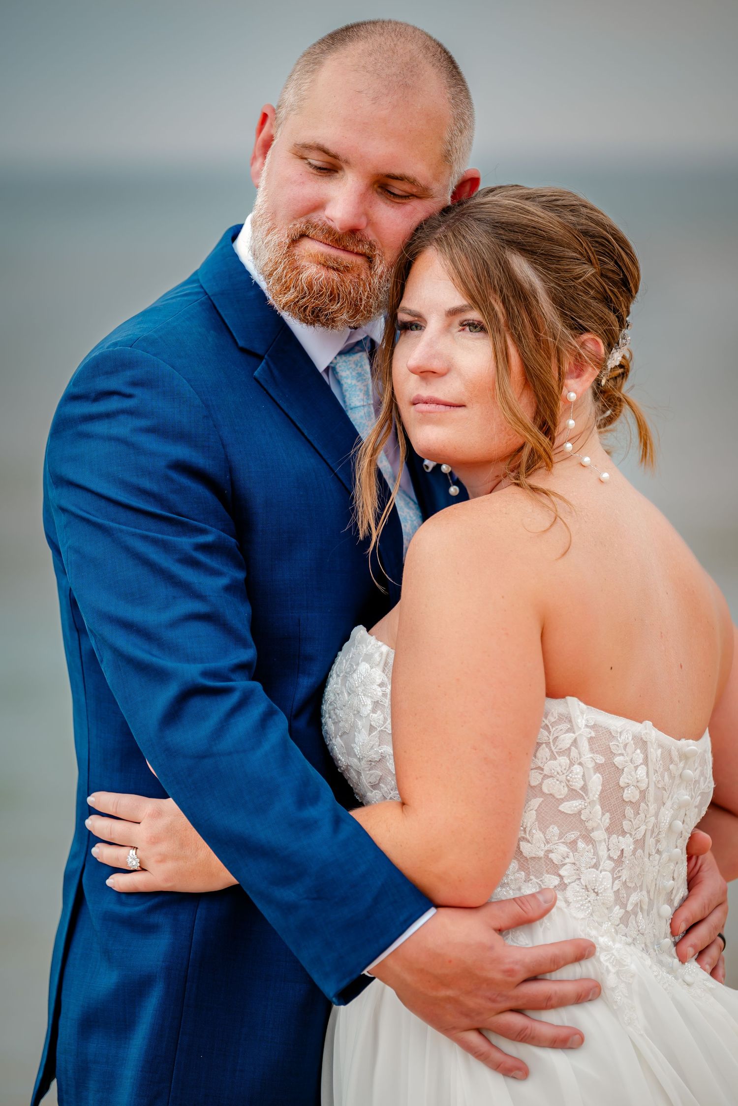 Romantic wedding couple embraces in a series of intimate close-up shots showing tender moments together.