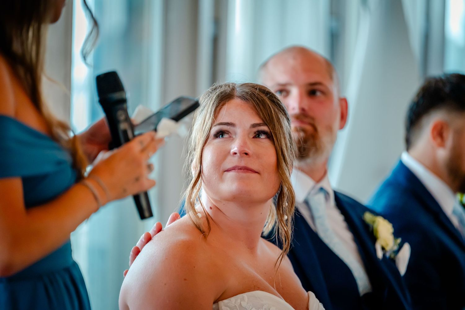 Wedding celebration candid moments captured indoors with natural lighting.