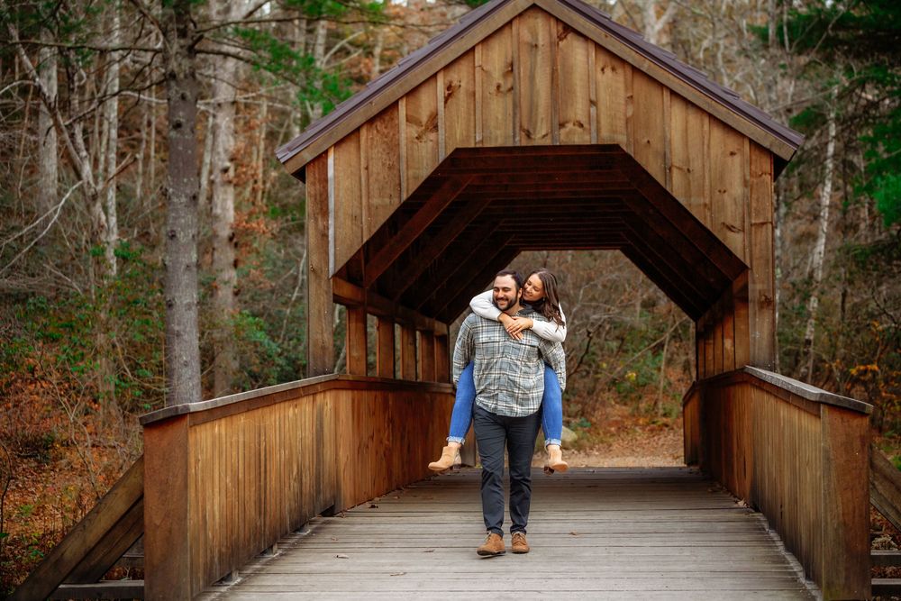 A series of romantic photos taken on a rustic wooden covered bridge surrounded by autumn forest scenery.
