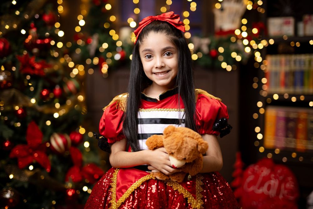 A festive holiday scene with twinkling Christmas lights and decorations in a cozy home setting.