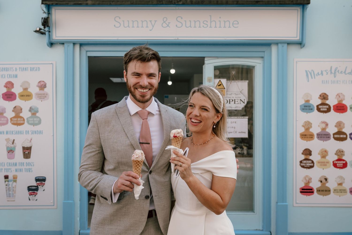 A newly wed couple stop in central Bath for an ice cream during their city photoshoot following being wed at the Guildhall, Bath.