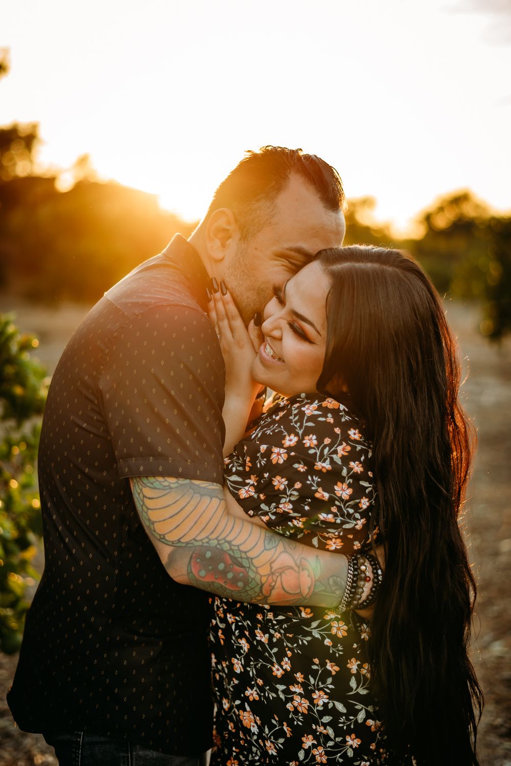Intimate sunset portraits with golden backlighting through trees.