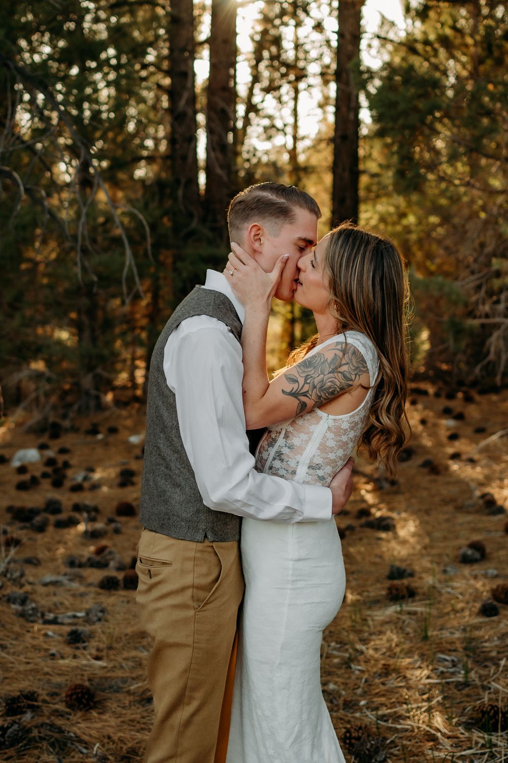 Romantic forest wedding photos with golden sunlight filtering through trees.