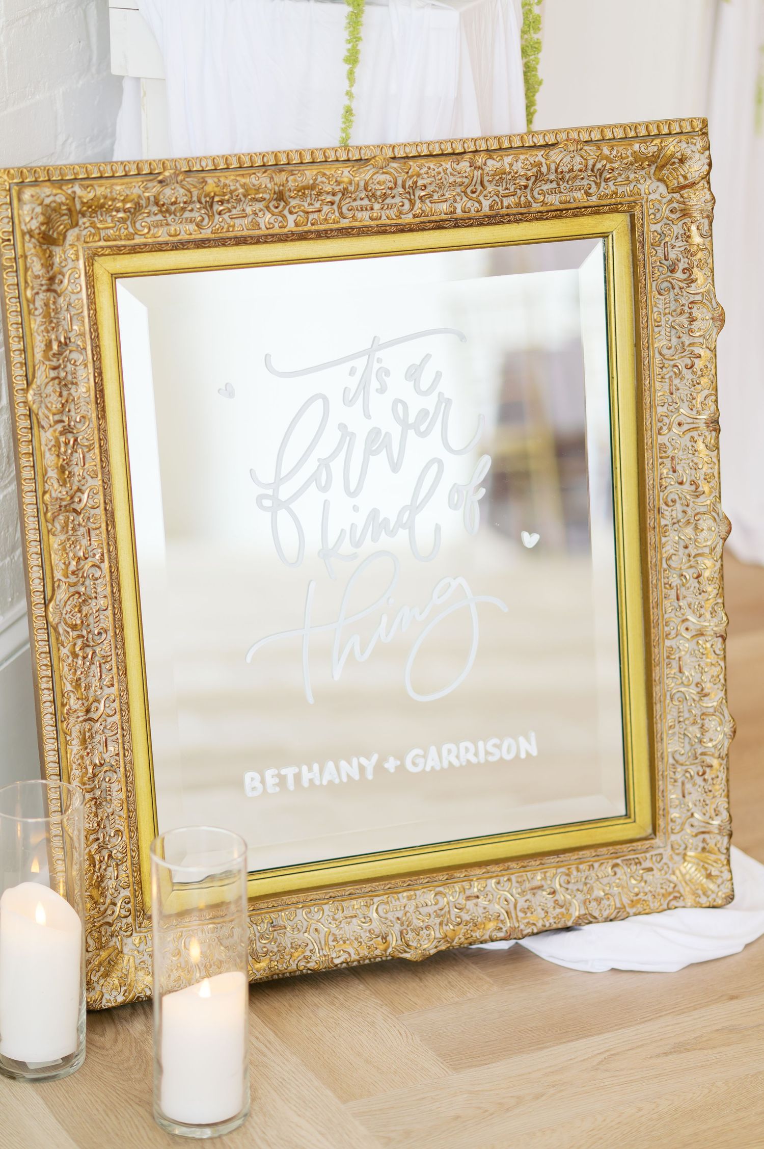 Ornate gold vintage frames displayed in a row with white text overlays for wedding signage.