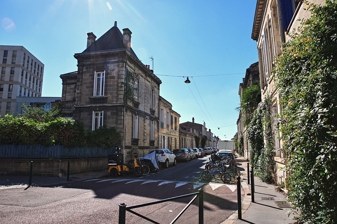 Panoramic view of a historic European city street with traditional architecture.