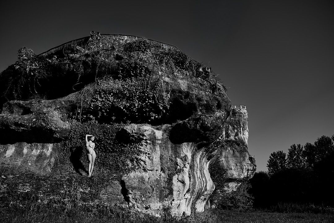 Dramatic black and white panorama of rugged cliff formations.
