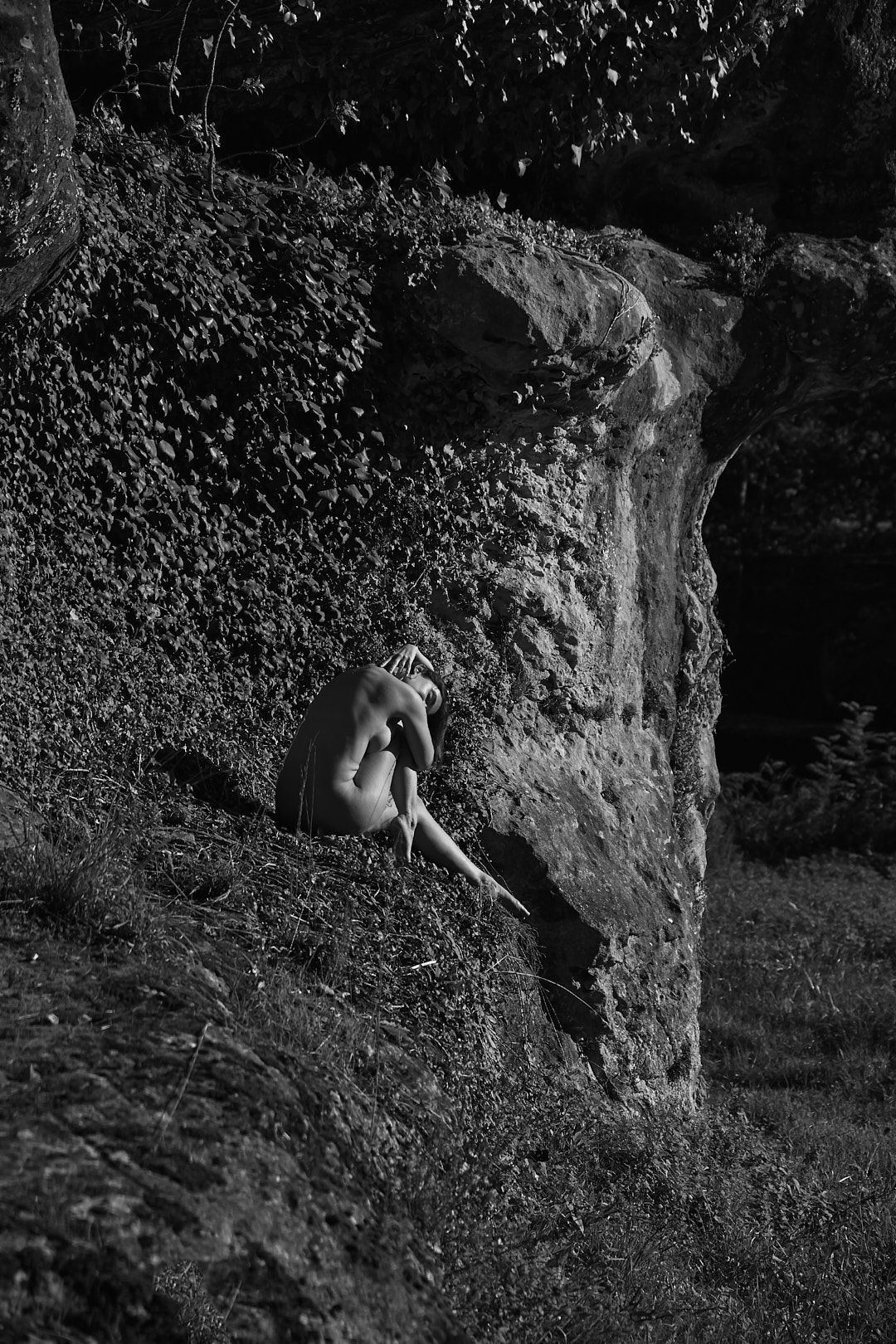 Series of black and white photographs showing a natural stone formation.