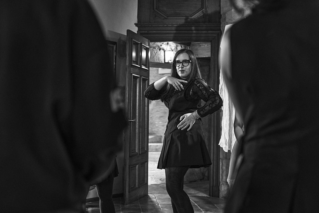 Dramatic black and white photo in a dimly lit vintage corridor.