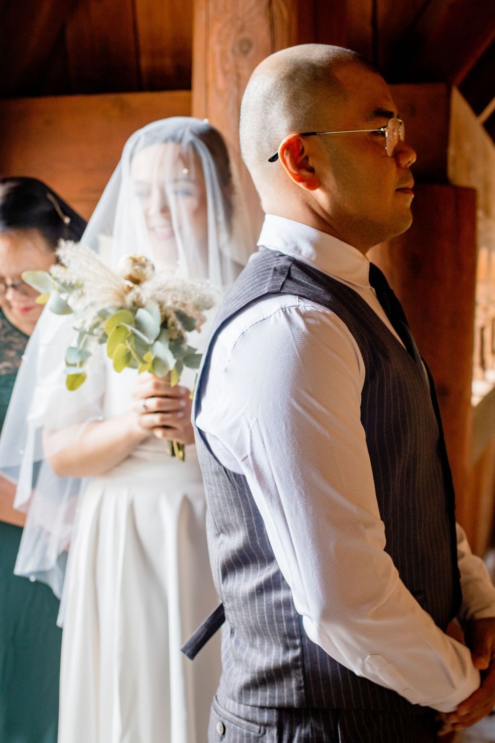 Wedding party members in formal attire preparing before the ceremony.