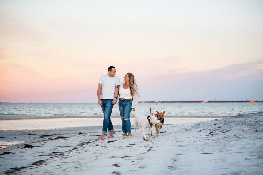 Destin Florida couples Photographer captures beautiful sunset colors during a photo session on the beach. Highly rated family photography