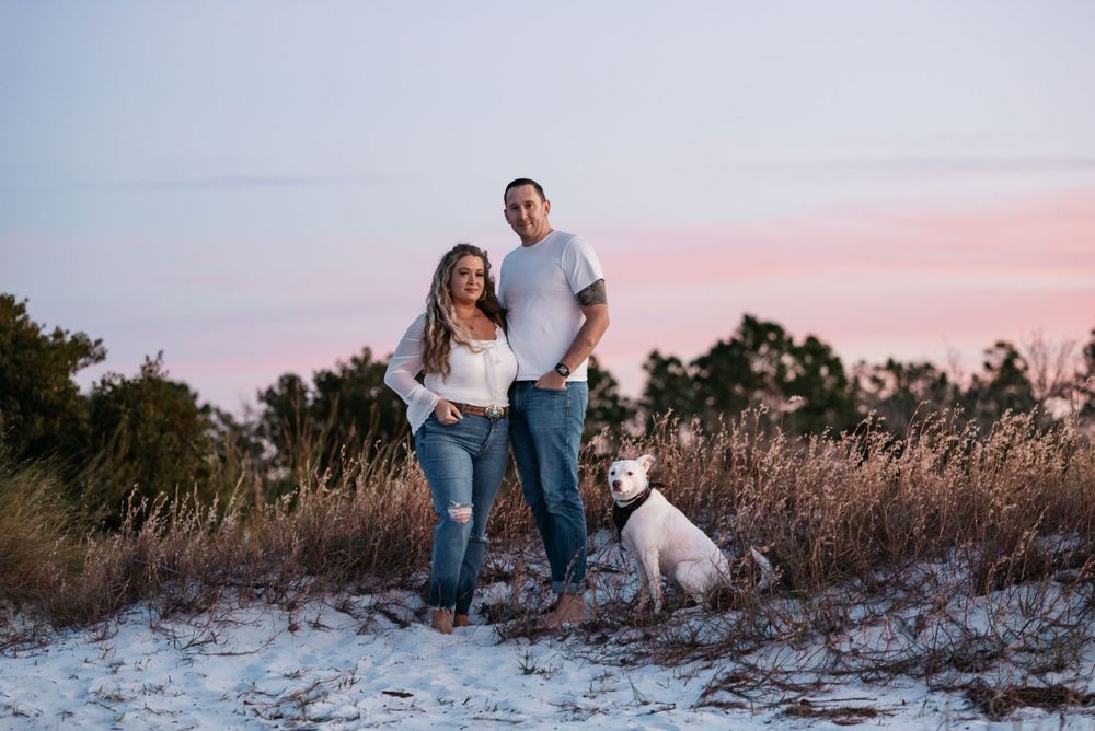 Destin Florida couples Photographer captures beautiful sunset colors during a photo session on the beach. Highly rated family photography