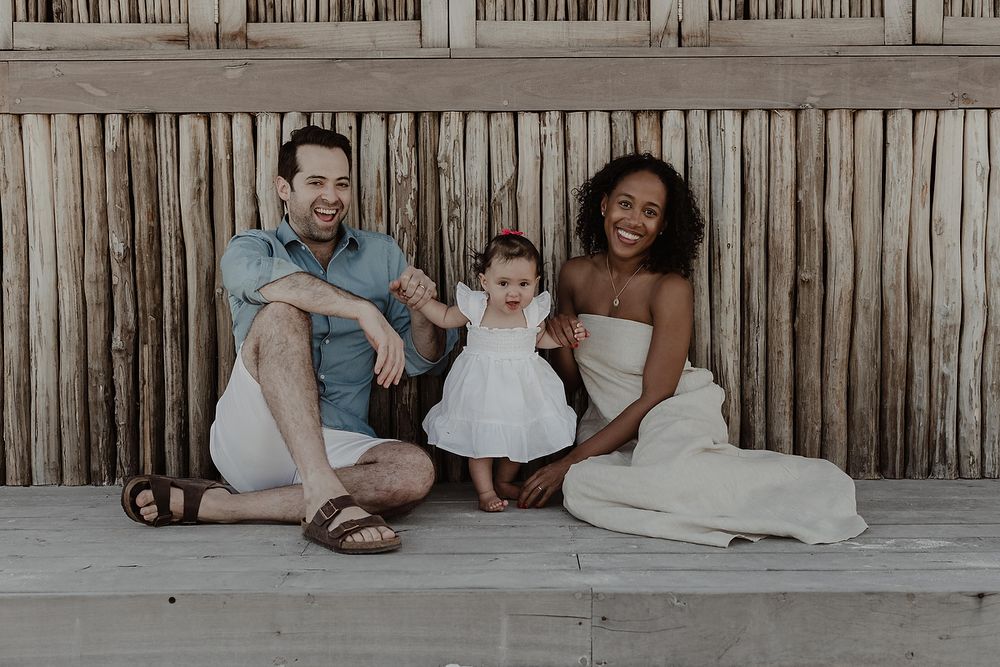 Relaxed family sitting together at The St. Regis Kanai Resort during Riviera Maya photoshoot.