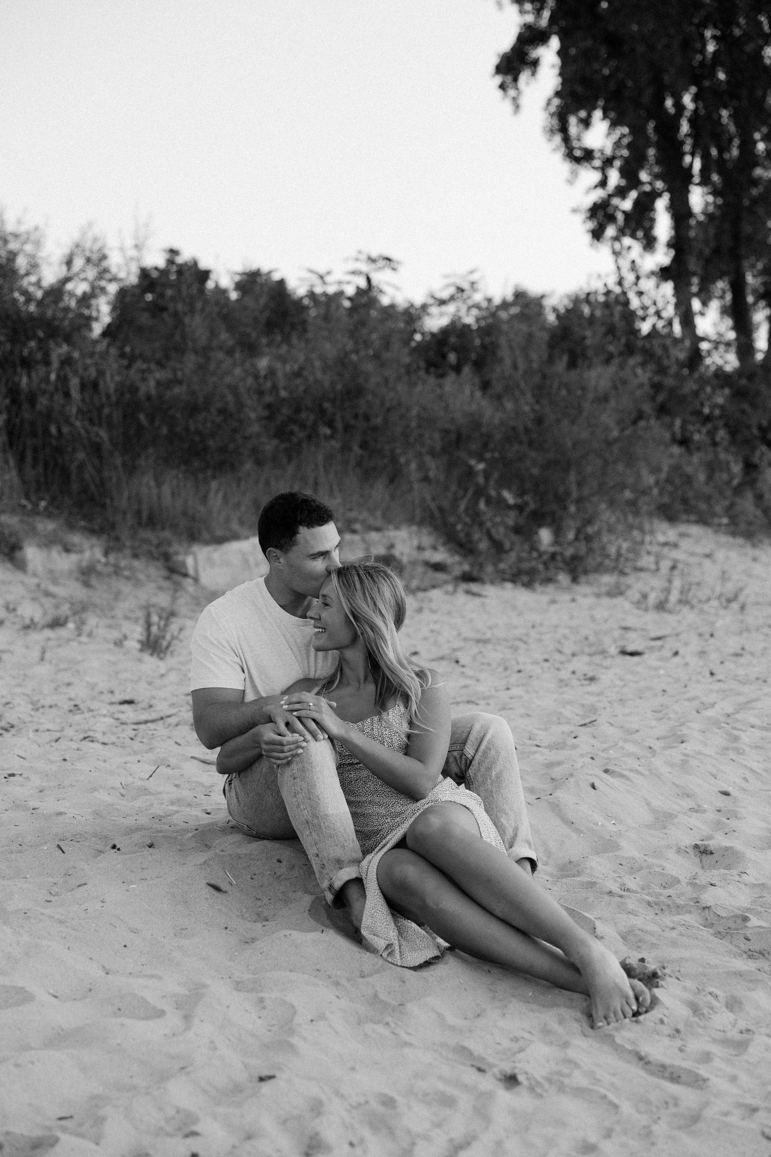 Natural candid engagement photos on the beach in Niagara, Ontario