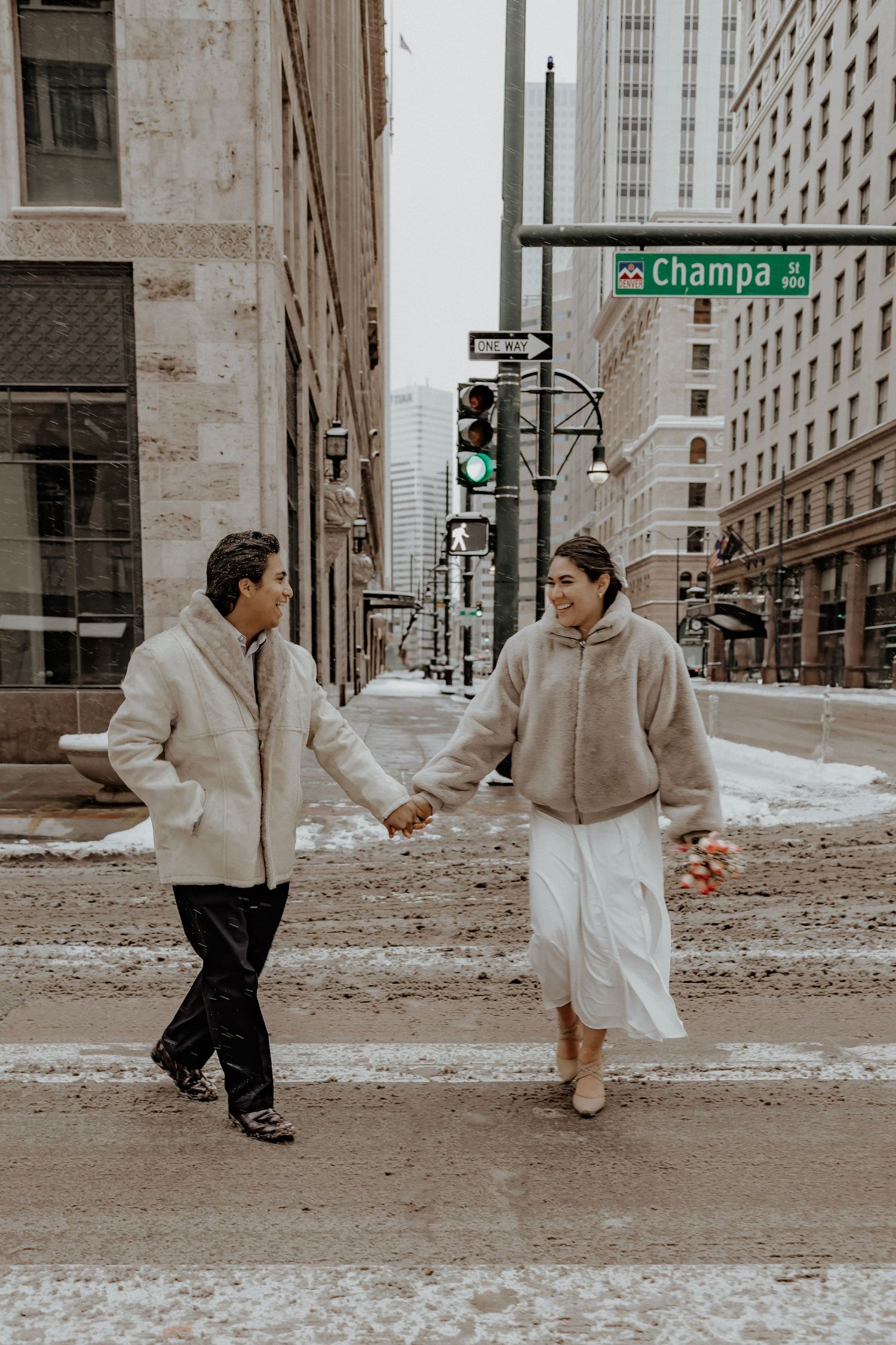 Couple walks through the streets holding hands