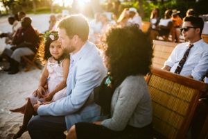 Candid family picture from a wedding happening in Cancun, Mexico, this image has a beatiful backlight in golden hour.