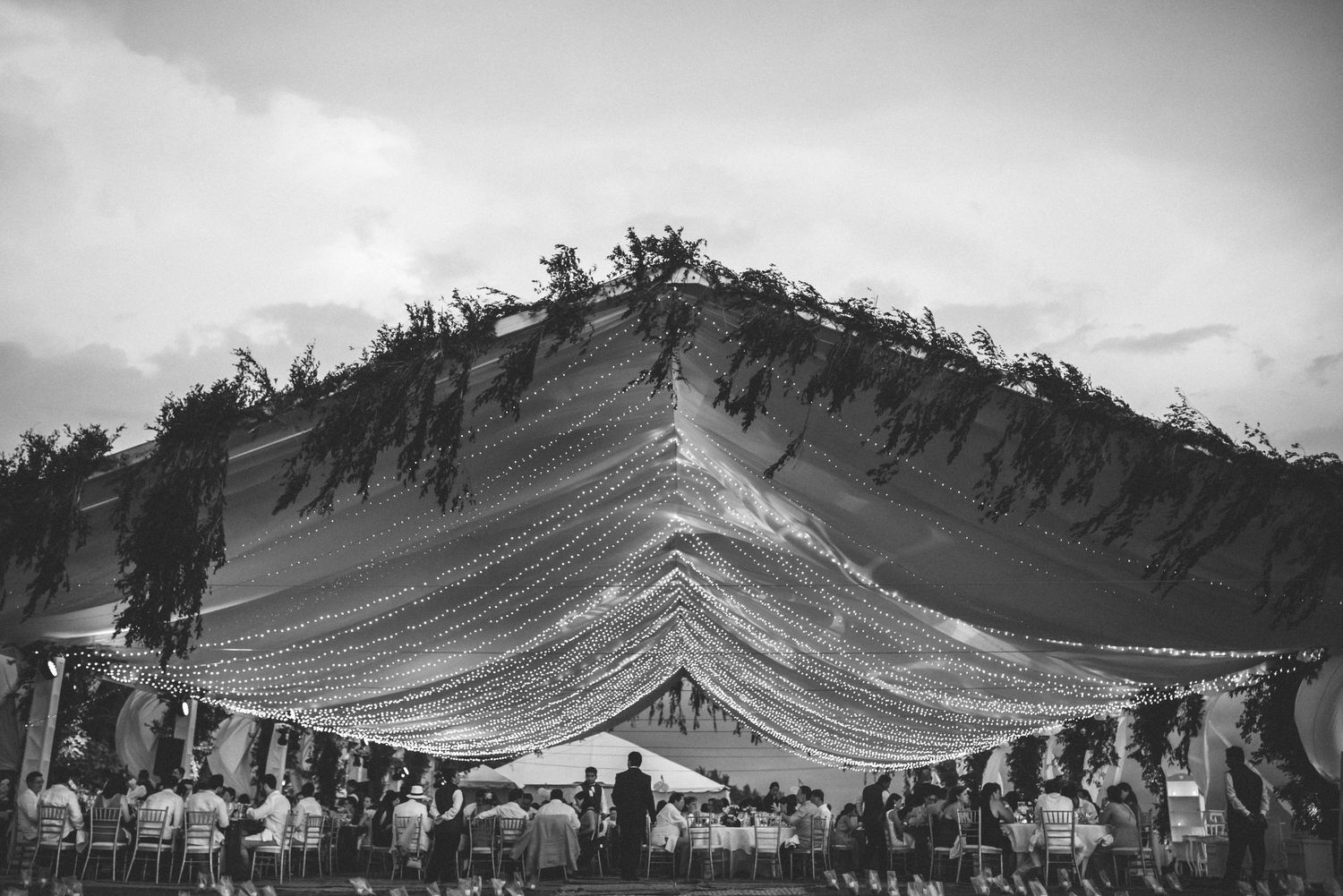 Black and white panoramic photo sequence showing a large wedding in Los Cabos, Mexico,
Los Cabos wedding photographer.