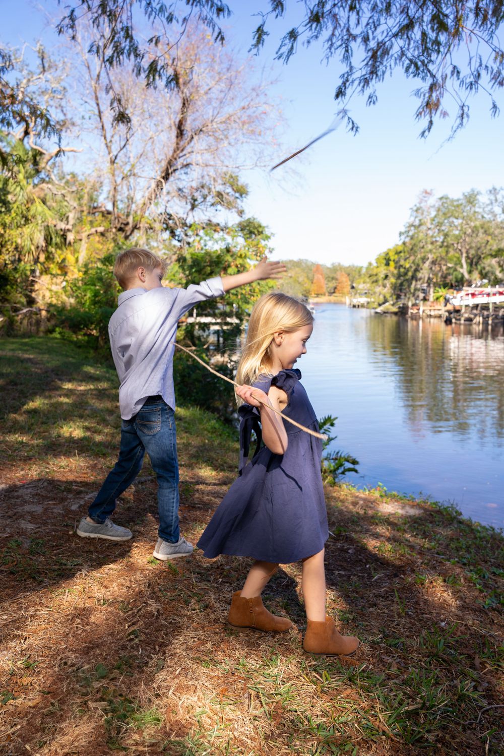 Candid outdoor photos near scenic lake with autumn foliage.