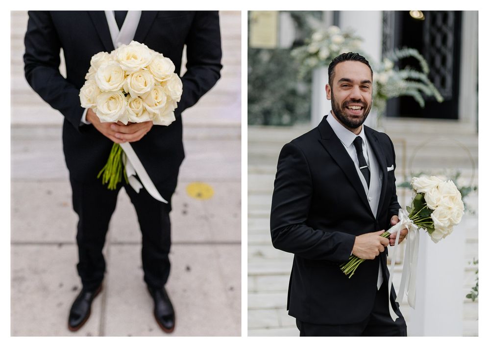 Groom in formal black suit holding a bouquet of white roses in wedding portraits.