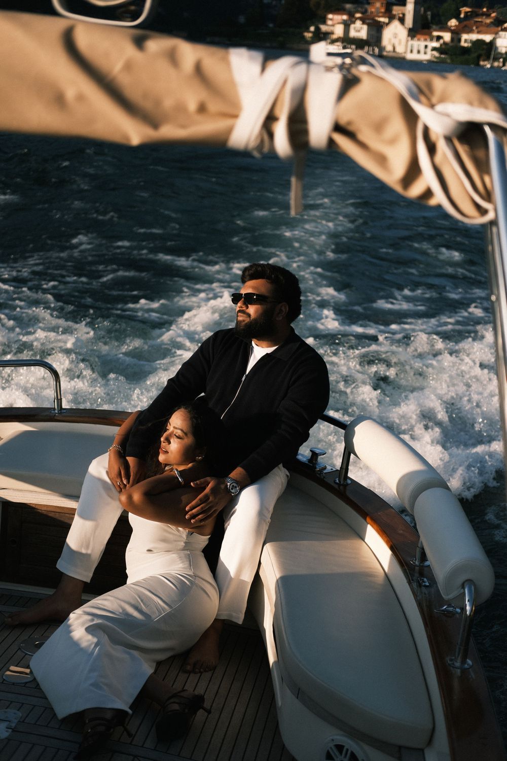 Romantic Lake Como boat photoshoot with couple at sunset.