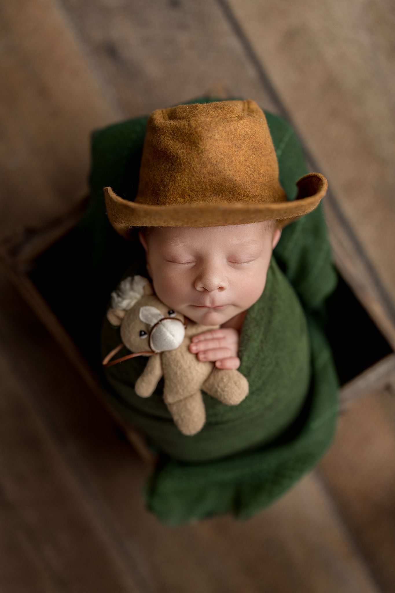 newborn baby girl wrapped for her newborn photos in Tulsa Oklahoma