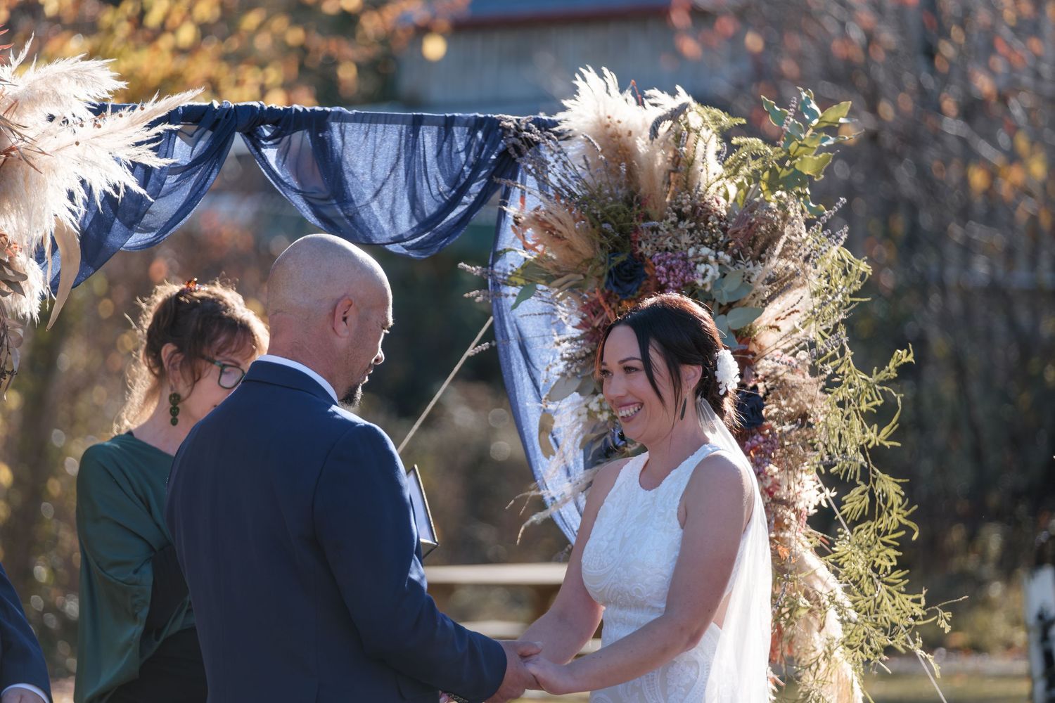 bride and and groom exchanging vows at the alter at Hanmer Springs forest camp