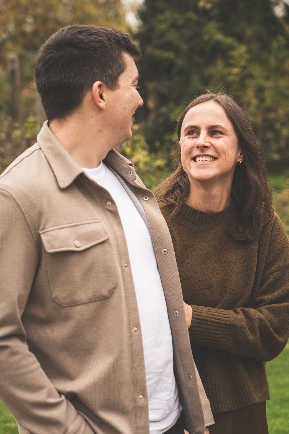 Candid sequence of a couple laughing and enjoying each other's company outdoors.