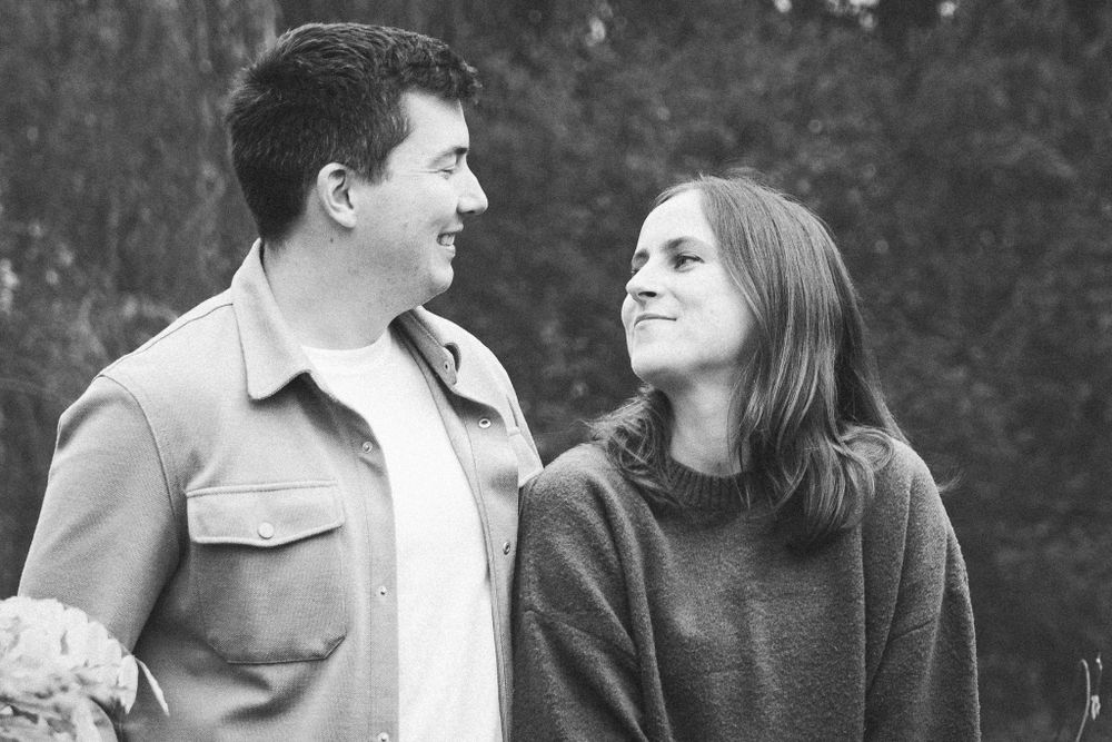Black and white series showing intimate moments between a couple in a natural setting.