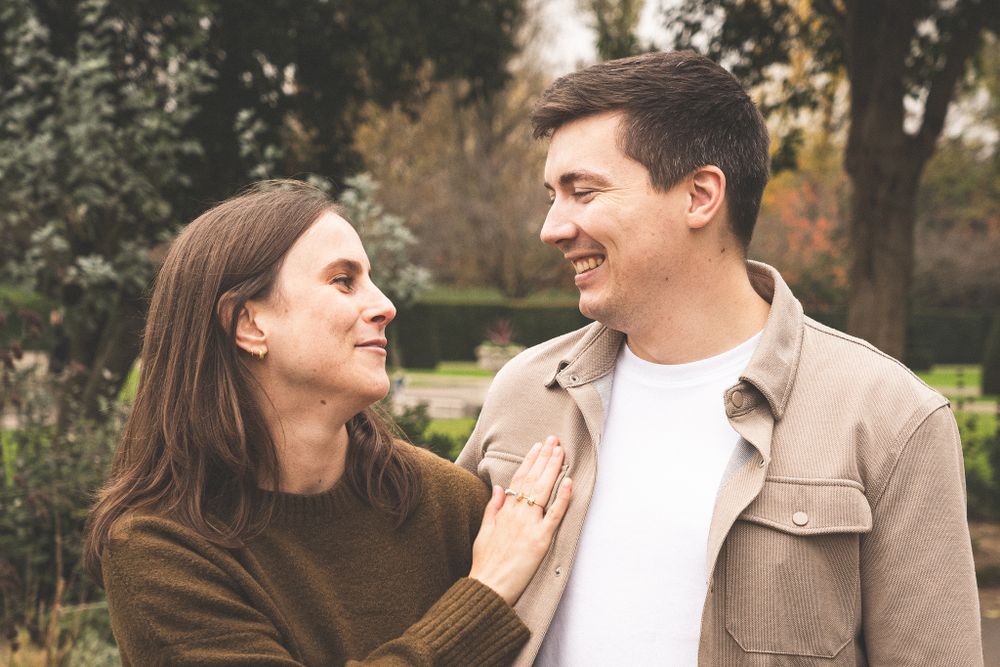 Candid sequence of tender moments between a couple in an outdoor garden setting.