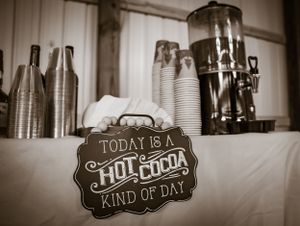 Vintage-style chalkboard signs with wedding messages displayed at reception venue.