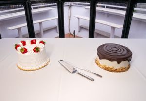 An assortment of desserts and cakes displayed on a white table setting.