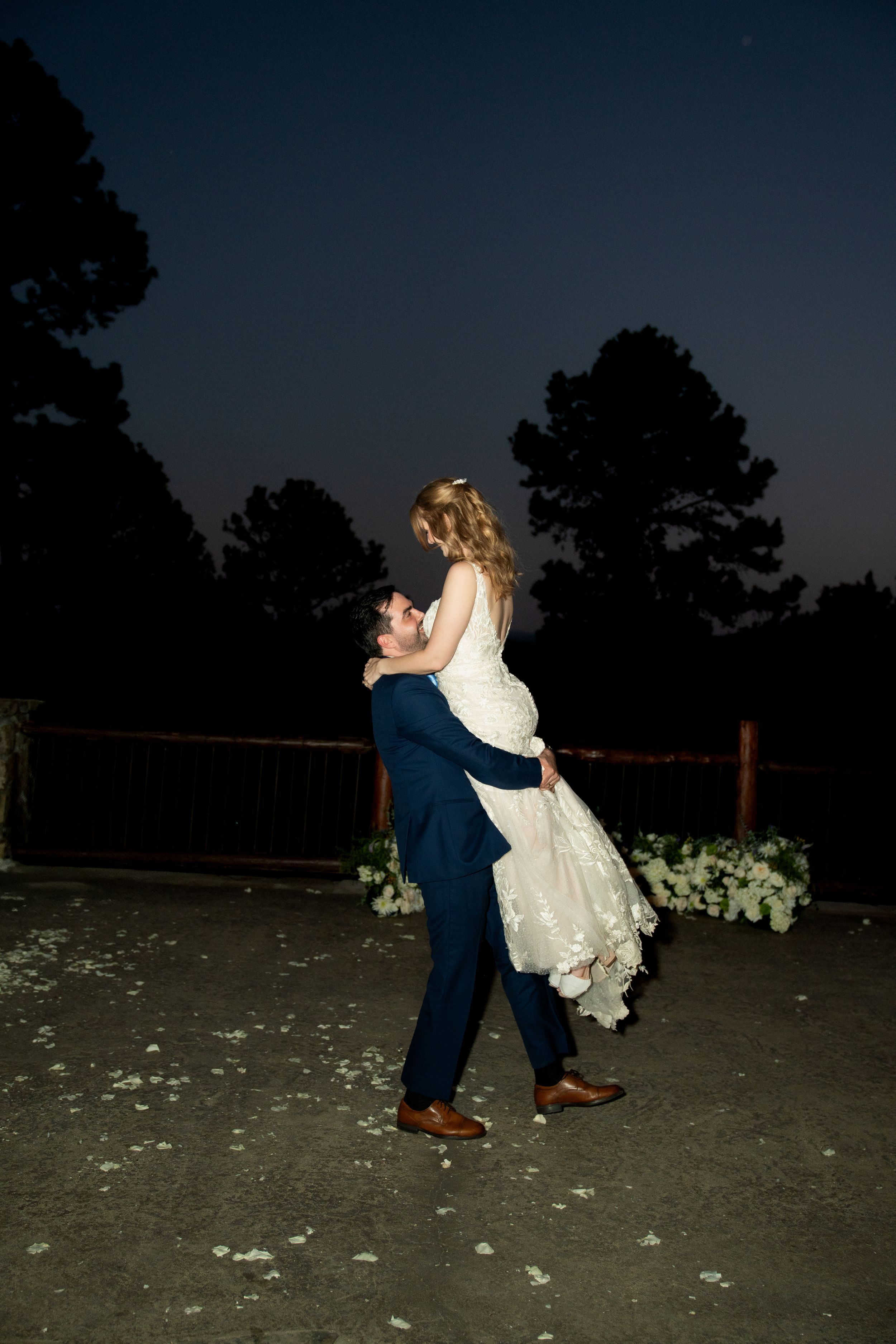Romantic evening dance sequence at an outdoor wedding reception.