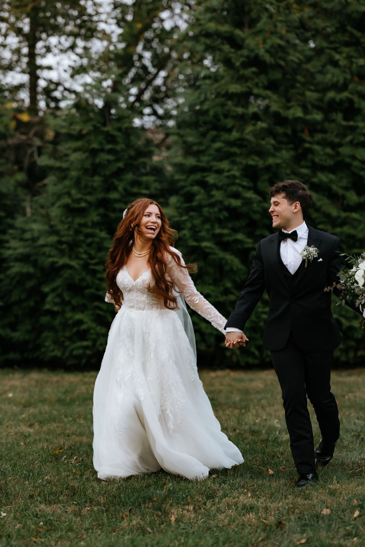 bride and groom running and holding hands at crystal grand banquets in lemont, illinois.