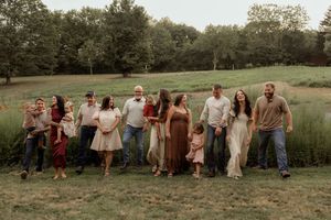 A panoramic sequence of people gathered in a rustic outdoor field setting during golden hour.