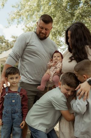 A candid series of family photos showing playful moments between parents and children outdoors.