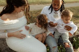 A tender moment captured at a wedding as the couple embraces and shares intimate moments in an outdoor setting.