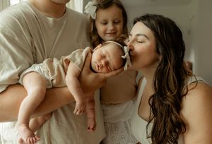 A tender moment between parent and baby showing gentle kisses and cuddles in a series of intimate photographs.